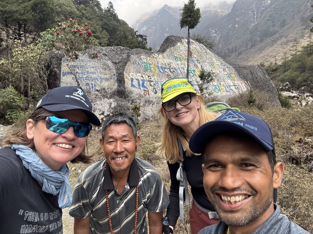 Our guests enjoy the beautiful kanchenjunga view with our guide and porter in this picture together